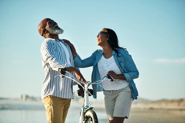 Happy couple biking