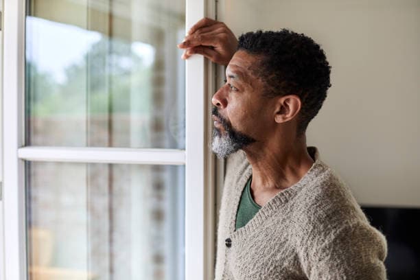 Man looking out of a window